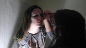 Photographer and makeup artist Beth Marie Cantu putting makeup on Katherine Orozco during the first photo shoot. 